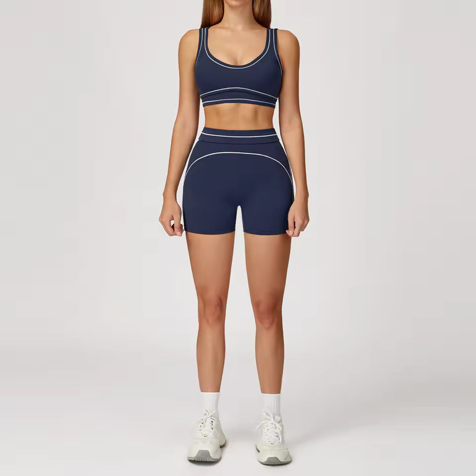 Conjunto de yoga feminino de 2 peças com contraste de cores, composto por sutiã desportivo e leggings de cintura alta, ideal para treino, corrida e fitness.