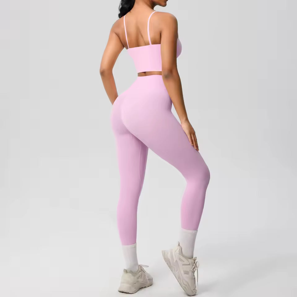 Conjunto desportivo feminino 2 peças — roupa de treino e ioga, com sutiã de suporte e leggings modeladoras para controlo abdominal.