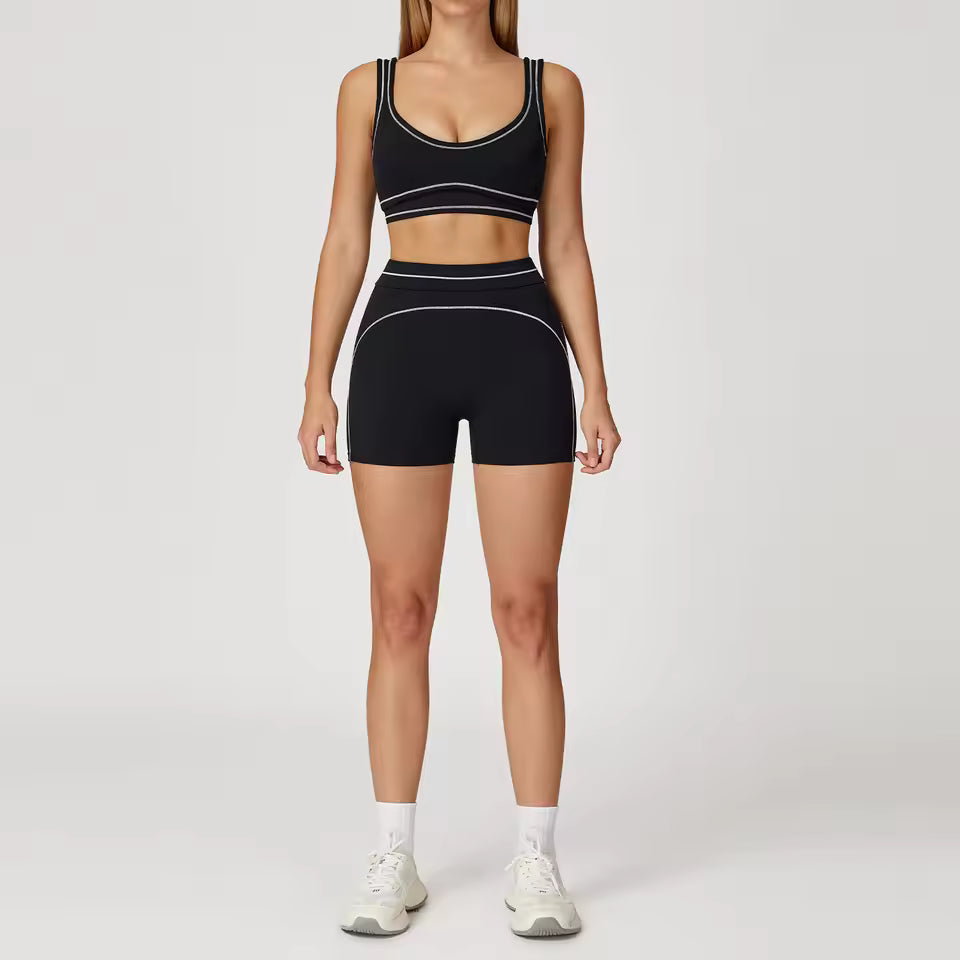 Conjunto de yoga feminino de 2 peças com contraste de cores, composto por sutiã desportivo e leggings de cintura alta, ideal para treino, corrida e fitness.