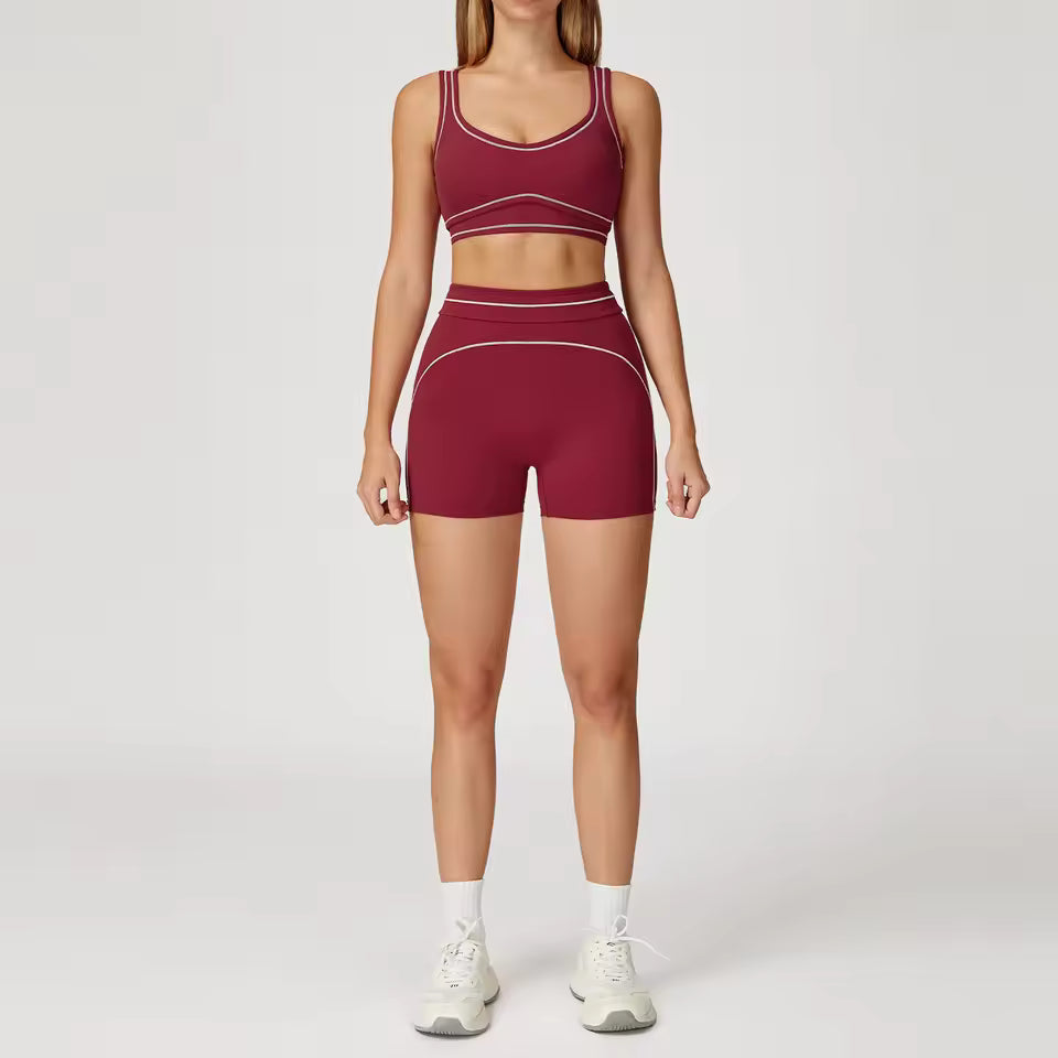 Conjunto de yoga feminino de 2 peças com contraste de cores, composto por sutiã desportivo e leggings de cintura alta, ideal para treino, corrida e fitness.