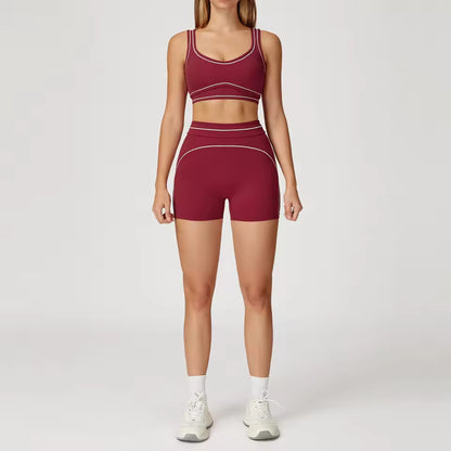Conjunto de yoga feminino de 2 peças com contraste de cores, composto por sutiã desportivo e leggings de cintura alta, ideal para treino, corrida e fitness.