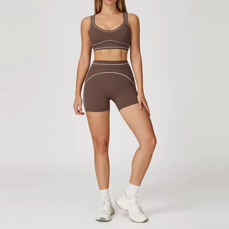 Conjunto de yoga feminino de 2 peças com contraste de cores, composto por sutiã desportivo e leggings de cintura alta, ideal para treino, corrida e fitness.