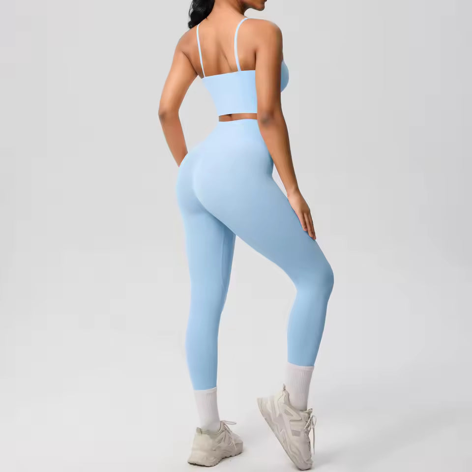 Conjunto desportivo feminino 2 peças — roupa de treino e ioga, com sutiã de suporte e leggings modeladoras para controlo abdominal.