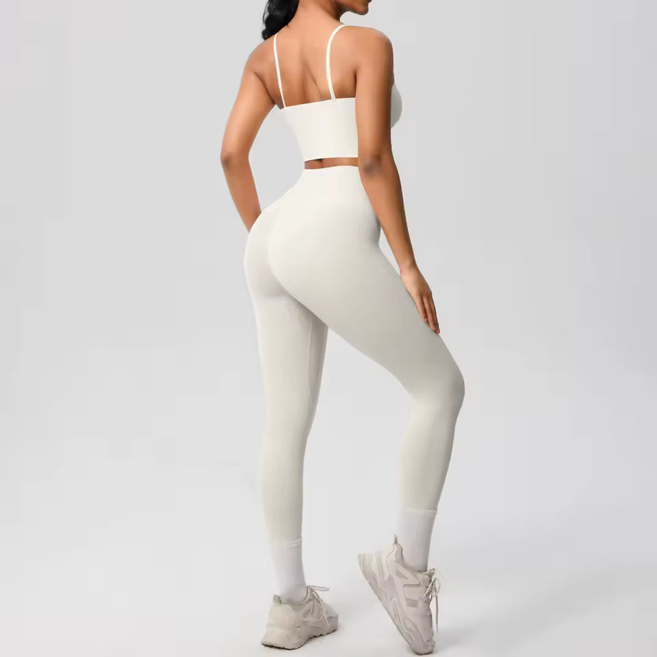 Conjunto desportivo feminino 2 peças — roupa de treino e ioga, com sutiã de suporte e leggings modeladoras para controlo abdominal.