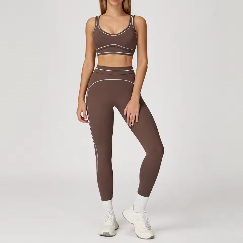Conjunto de yoga feminino de 2 peças com contraste de cores, composto por sutiã desportivo e leggings de cintura alta, ideal para treino, corrida e fitness.