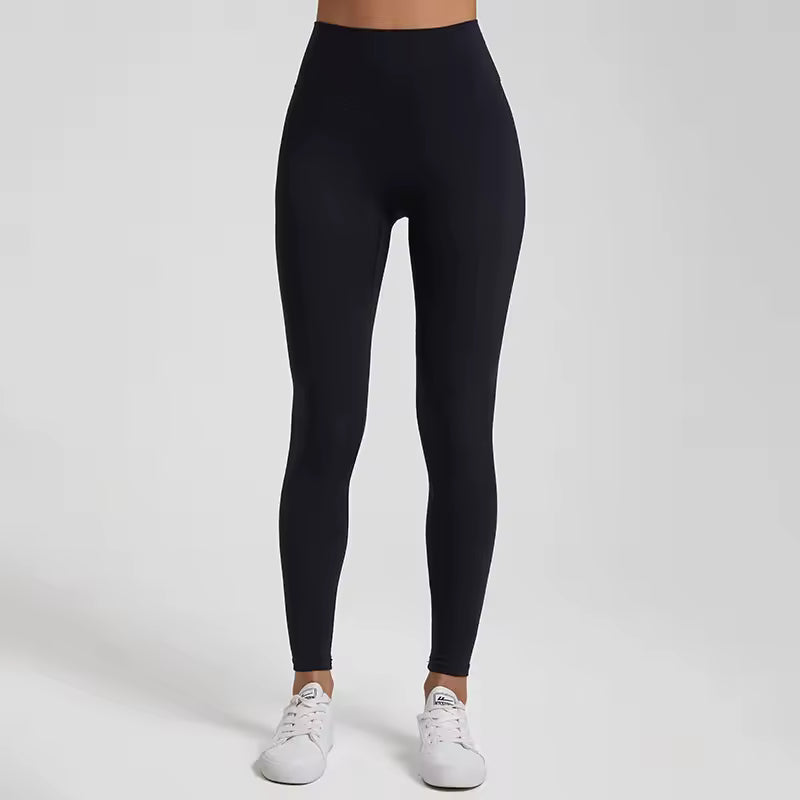 Conjunto feminino de leggings e sutiã de fitness em cor sólida — tecido macio, ajustado e resistente, ideal para treino de alta intensidade e à prova de agachamentos.