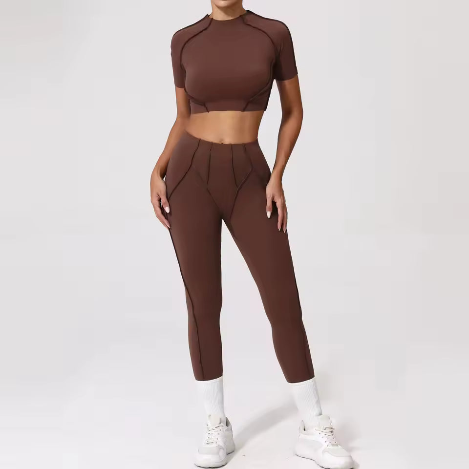 Conjunto de fitness feminino — agasalho de ioga com top de manga curta e leggings de cintura subida, ideal para treino e ginásio.