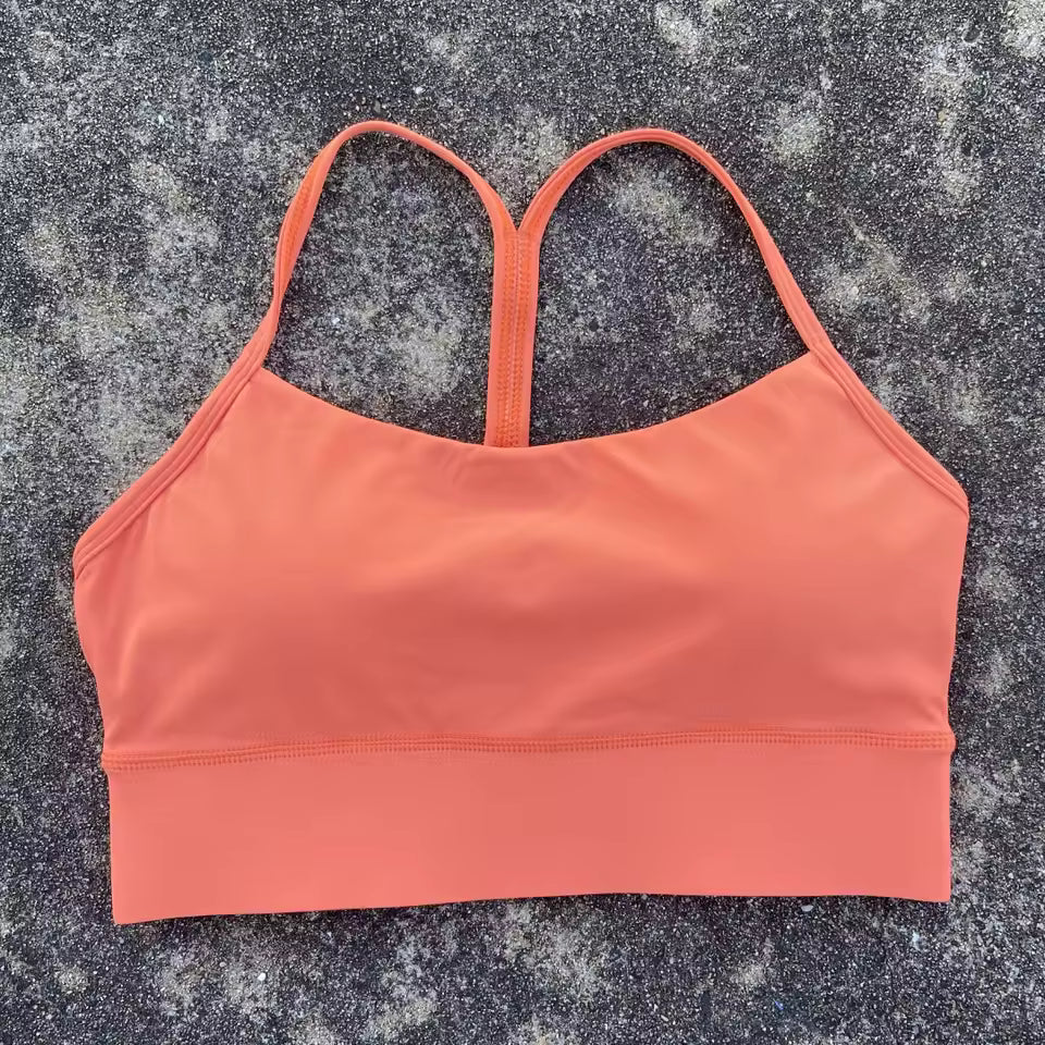Top desportivo feminino de cor sólida, com formato em Y, macio e ajustado, ideal para treino completo, corrida, ginásio ou ioga, com almofadas removíveis no peito.