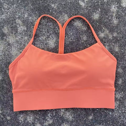 Top desportivo feminino de cor sólida, com formato em Y, macio e ajustado, ideal para treino completo, corrida, ginásio ou ioga, com almofadas removíveis no peito.