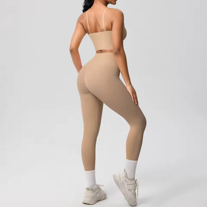 Conjunto desportivo feminino 2 peças — roupa de treino e ioga, com sutiã de suporte e leggings modeladoras para controlo abdominal.