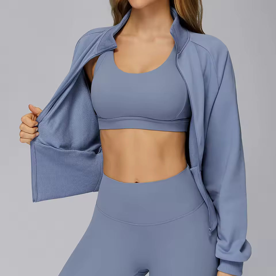 Casaco desportivo feminino de inverno para yoga, com mangas compridas, gola alta, zíper, resistente ao vento e quente — moletom solto ideal para atividades ao ar livre e corrida.