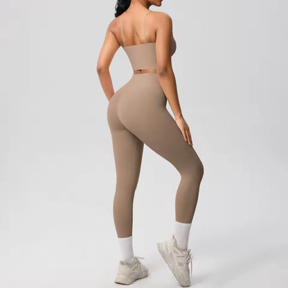 Conjunto desportivo feminino 2 peças — roupa de treino e ioga, com sutiã de suporte e leggings modeladoras para controlo abdominal.