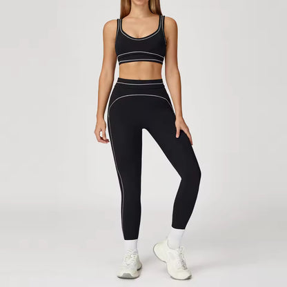 Conjunto de yoga feminino de 2 peças com contraste de cores, composto por sutiã desportivo e leggings de cintura alta, ideal para treino, corrida e fitness.