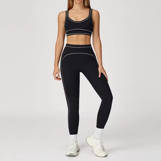 Conjunto de yoga feminino de 2 peças com contraste de cores, composto por sutiã desportivo e leggings de cintura alta, ideal para treino, corrida e fitness.