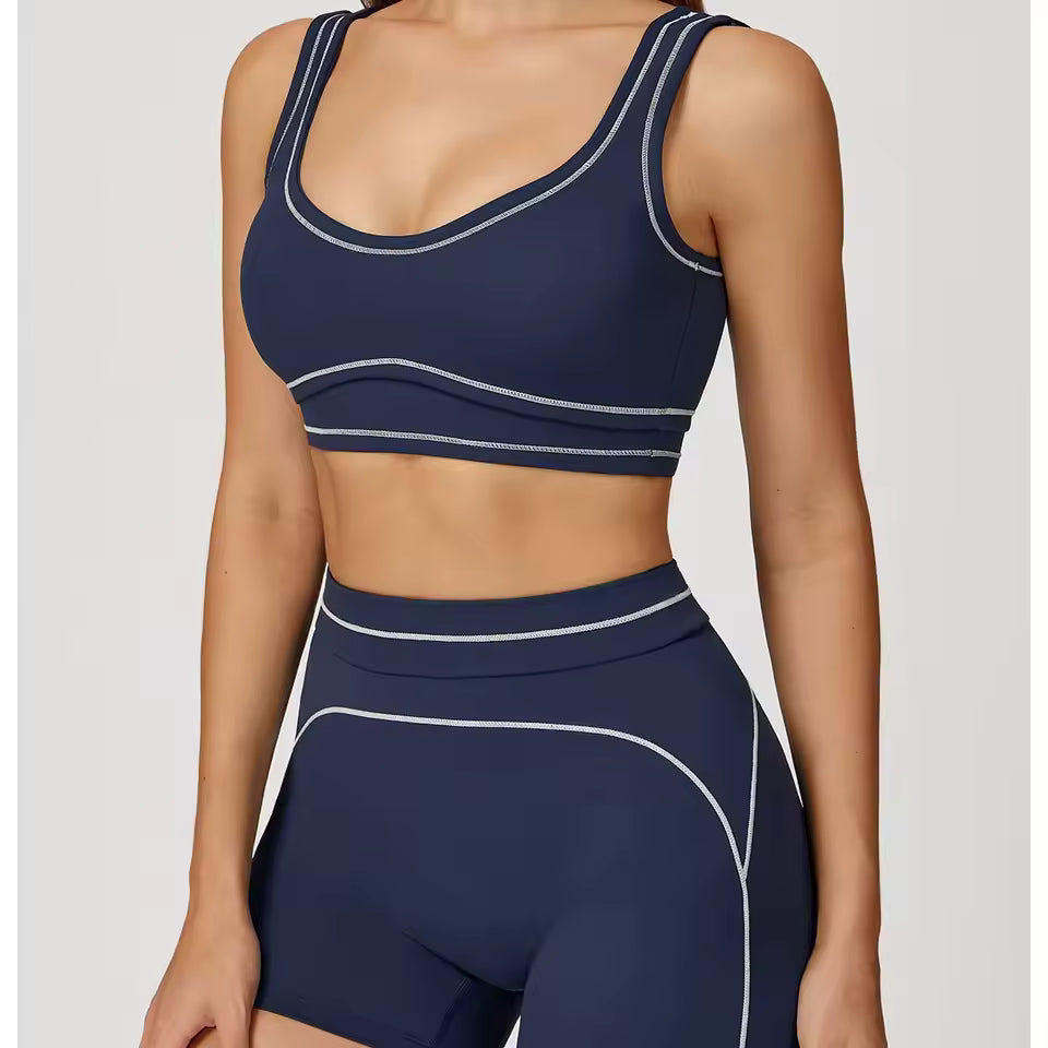 Conjunto de yoga feminino de 2 peças com contraste de cores, composto por sutiã desportivo e leggings de cintura alta, ideal para treino, corrida e fitness.