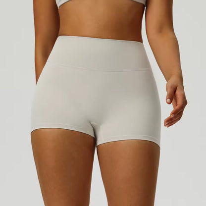 Shorts desportivos femininos de cintura alta, cor sólida, macios, respiráveis e de secagem rápida, ideais para treino, ciclismo, yoga e ginásio